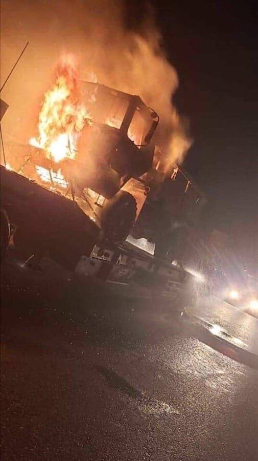 A column of American equipment burned on the way to the base in Iraq